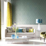 Contemporary  lounge / living room with sofa and ornaments in front of large window with curtains